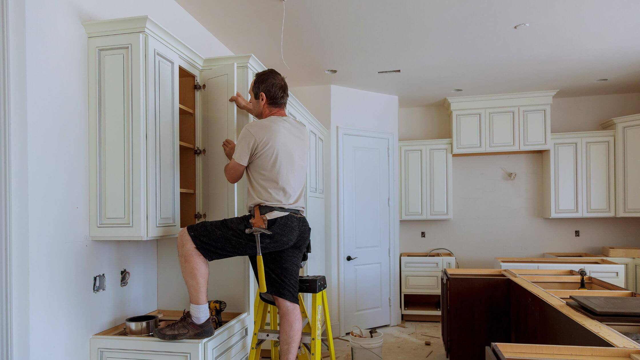 painting and repairing kitchen cabinet